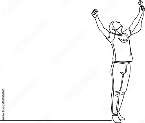 Man standing with arms raised high.