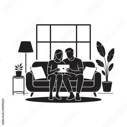 Couple relaxing on a sofa viewing content on a digital tablet
