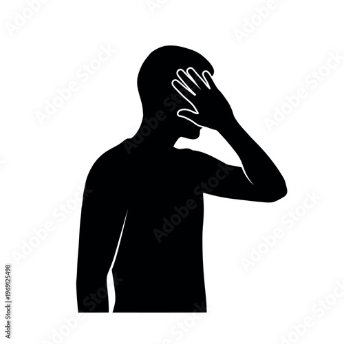 Man covering face with hand silhouette.