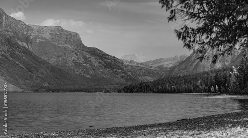 Moody Black and White Mountain Lake Landscape with Forest and Shoreline