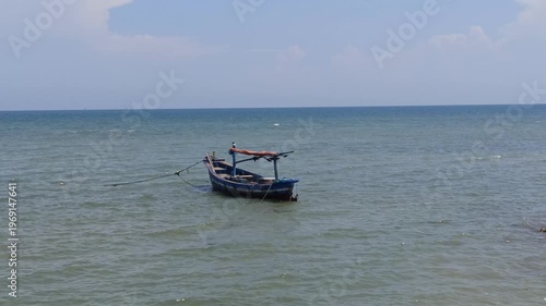 Wallpaper Mural A serene scene of fishing boats resting at the dock while the tide rises, with calm water surrounding the vessels and reflecting a quiet coastal atmosphere filled with daily maritime life. Torontodigital.ca
