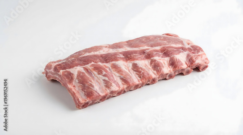 Raw pork rib piece on a white background