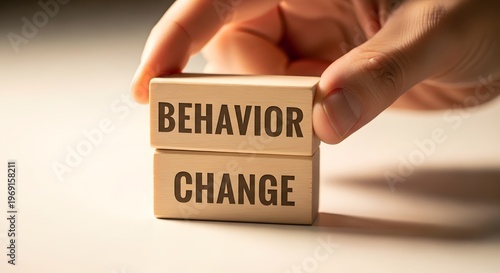 Behavior Change Concept - Wooden Blocks with Words Held by Hand