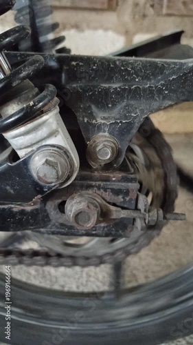 Wallpaper Mural A motorcycle chain on an underbone bike transfers engine power to the rear wheel, highlighting its function, durability, and role in smooth riding performance. Torontodigital.ca