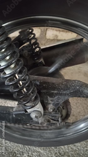 Wallpaper Mural A motorcycle chain on an underbone bike transfers engine power to the rear wheel, highlighting its function, durability, and role in smooth riding performance. Torontodigital.ca