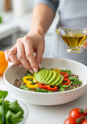 Preparing vibrant salad with avocado and olive oil for healthy nutrition