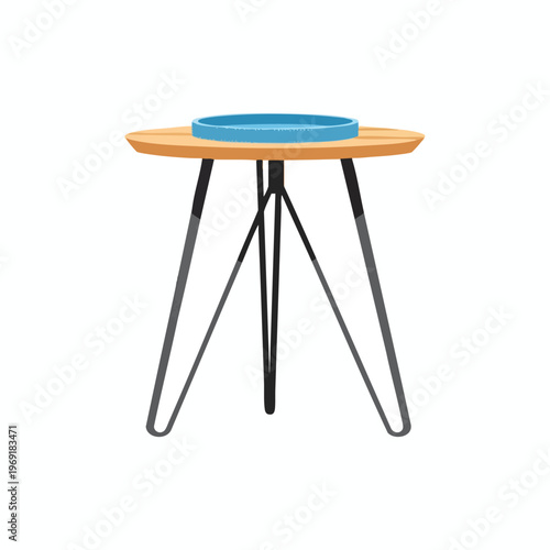 Round wooden table with hairpin legs supporting a blue dish