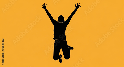 Silhouette of a person jumping with arms raised in celebration.