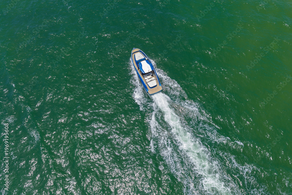 Fototapeta premium Luxury boat yachting. Motorboat sailing at sea. Luxury private yacht in sea. Motor yacht luxury vessel. Boat motor aerial. Vacation on summer. Aerial view on motorboat. Yacht boat tour