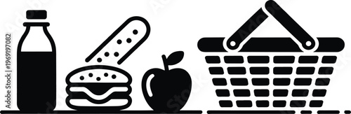 Picnic basket filled with sandwiches, drinks, and fruit represents a perfect outdoor meal for a sunny day, ideal for leisure activities and family gatherings.