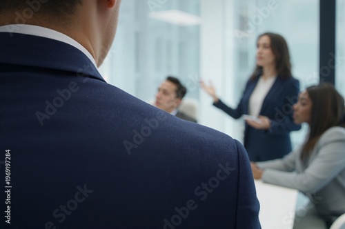 Professional Woman Leads Business Presentation, Over-the-Shoulder View.