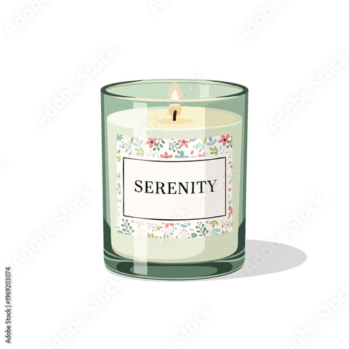 Glass candle with floral label and lit wick on white background
