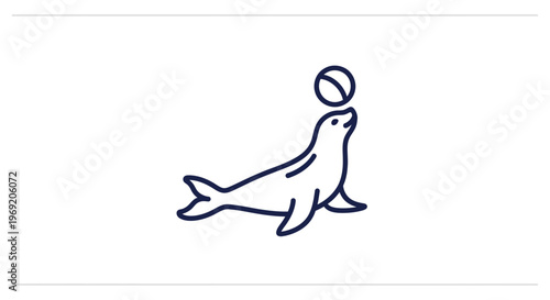 Playful marine animal balancing an orb on its nose, showcasing aquatic grace and fun activity