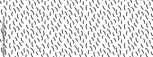 Seamless pattern of black curved dashes on white background. Thin curved brush strokes scattered randomly on white background. Abstract minimal doodle texture