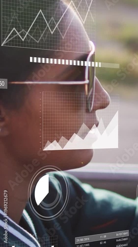 Watching Indian driver focusing in car, wearing green top and reflective sunglasses, HUD overlays