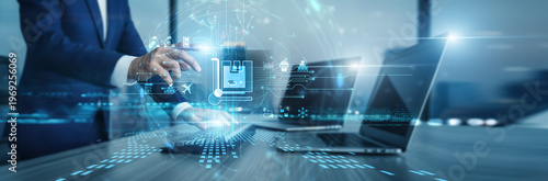 Фотография Manager Logistics working on computer systems to track global supply chain moves
