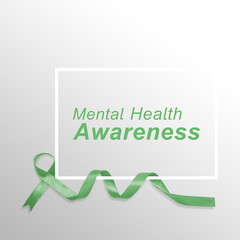 A green ribbon for mental health awareness positioned with a white sign featuring the text Mental Health Awareness on a neutral gray background