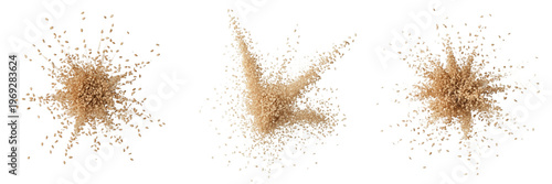 Quadro su tela Explosion of brown sugar or sand particles isolated on white background