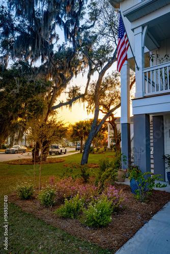American flag on coastal home at sunset in trendy South Carolina neighborhood