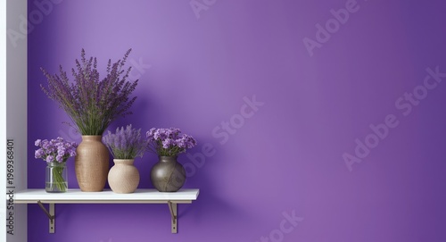 Shelf wall with array of purple flowers in vases paired with vivid violet large format print backdrop