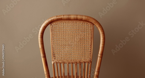 Traditional rattan chair backrest shown with a muted wall backdrop