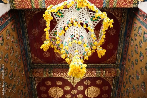 Khruang kwaen: a traditional Thai floral mobile made up of elaborate woven garlands of jasmines, marigolds and other flowers at Wat Arun, the Temple of Dawn in Bangkok, Thailand
