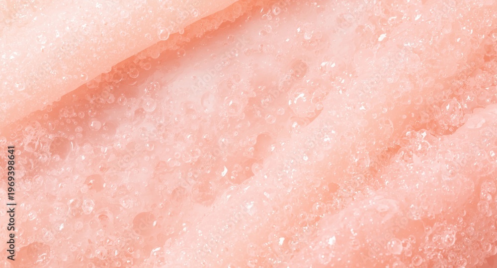 Fototapeta premium Pastel toned exfoliating body scrub showing bubble texture close up for relaxing skin treatment sessions