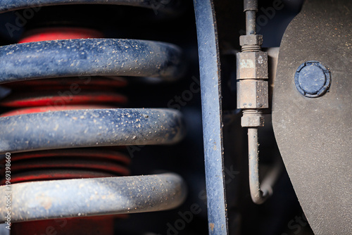 The suspension of a four-wheel drive pickup truck that has been used for rough use