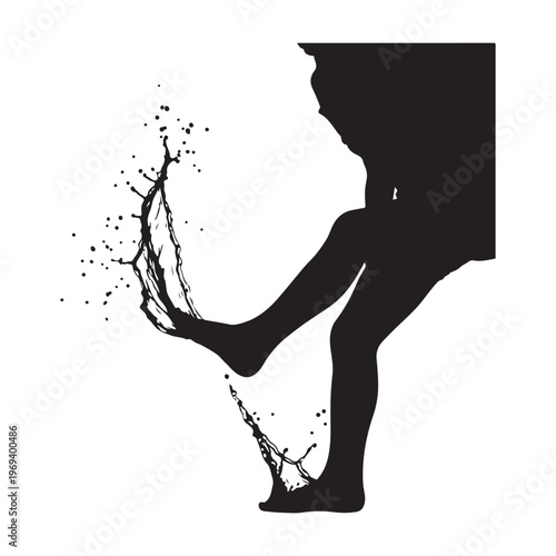 Silhouette of a person kicking with liquid splashing from their foot
