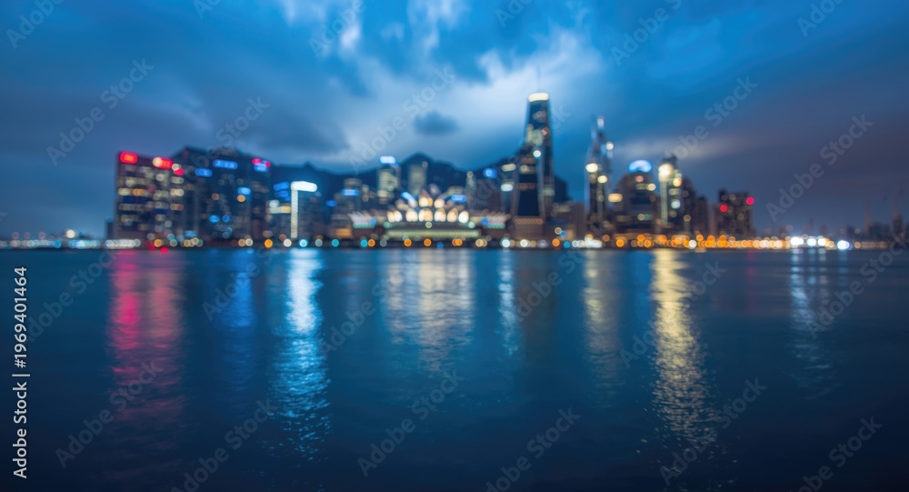 Naklejka premium Urban skyline blurred by electric blue sky reflections and atmospheric effects on water