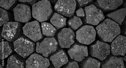 Top view of natural hexagonal basalt column structures captured in monochrome