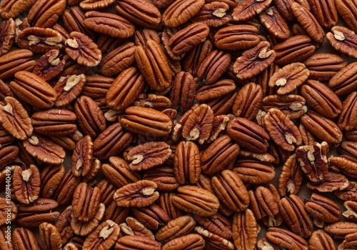 A rich, textured scattering of brown pecan nuts, perfect for baking, snacking, or holiday ingredient preparation ,snack ,food ,rustic