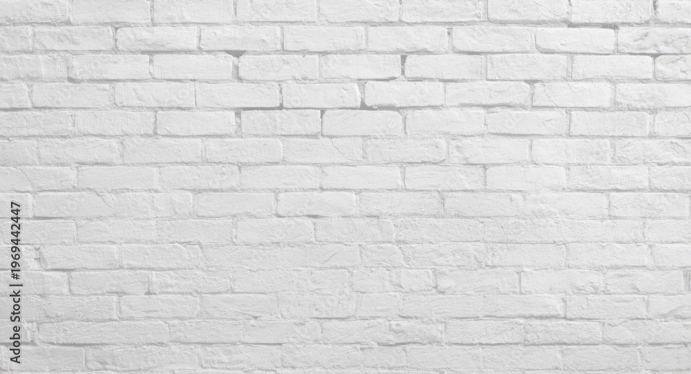 Fototapeta premium Textured white brick wall background with subtle shadows and copy space