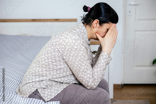 Bild auf Leinwand Depressed mature woman experiencing menopause or perimenopause