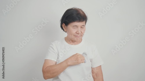 Elderly with Gray ribbon for May Brain Cancer Awareness month and Asthma Awareness, Support life people Survivor. Healthcare and February World cancer day