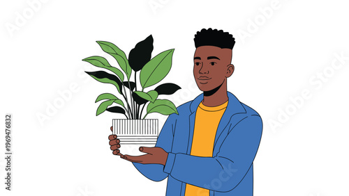 Young man holding a potted green plant with both hands representing an interest in gardening indoor plants or environmental care.
