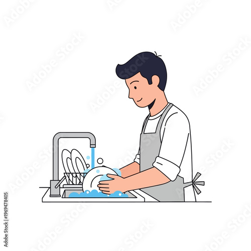 Young man washing dishes by hand in a modern kitchen sink with running water and soap bubbles.