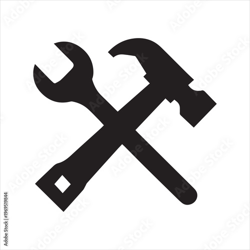 Black silhouette of a wrench and hammer crossed on a white background