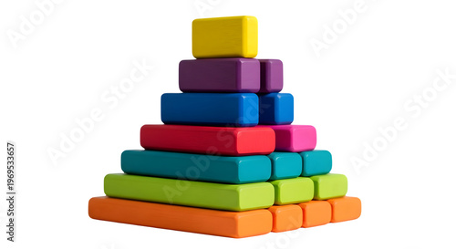 A stack of colorful blocks arranged in a pyramid shape on a surface