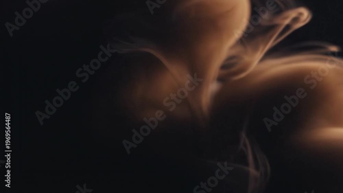 Abstract swirling smoke or vapor forms in a dark, moody atmosphere
