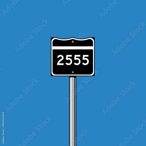 Number plate on a metal pole.