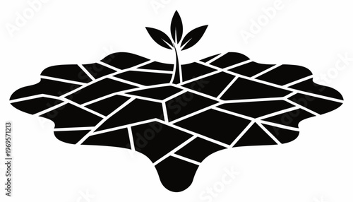 Black silhouette of cracked drought land with single sprouting plant on dry barren earth