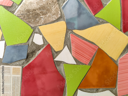 Vibrant Mosaic Artwork Displaying Assemblage of Colored Tiles. Array of brightly colored and textured tiles arranged in captivating mosaic pattern. Full frame. Close-up. Copy space