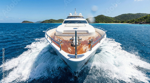 View from luxury yacht bow cruising tropical ocean towards islands.