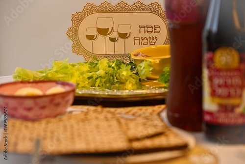 Traditional Passover Seder table set for Jewish holiday celebration in Israel, featuring festive dinner setup, symbolic foods, wine glasses, and family gathering atmosphere for Pesach evening.