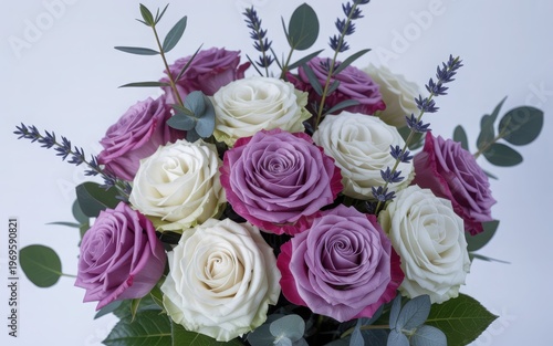 Elegant bouquet of roses and baby's breath in a soft purple and white color scheme