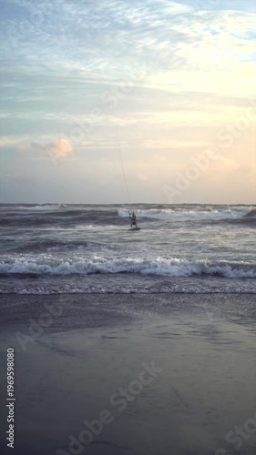 Kite Flying over Ocean with Kitesurfer at Canggu Beach Bali