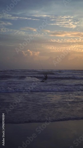 Kitesurfer Silhouette at Golden Sunset on Canggu Beach Bali Ocean