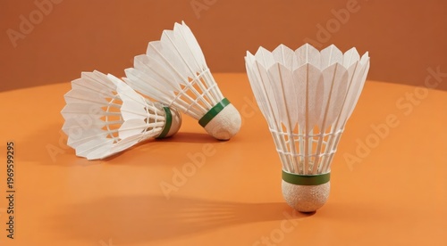 Close-Up of White Shuttlecocks on Orange Background for Badminton Sports and Training Equipment