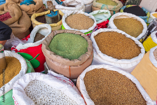 Various types of spices in a sack to sale in a retail market